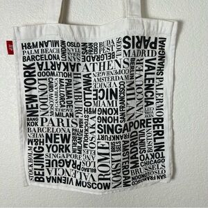 HM reusable flat canvas Boho travel tote bag w/ city names printed on it